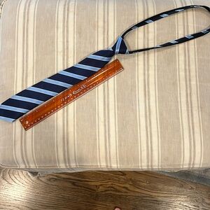 Like new navy and light blue striped zip tie